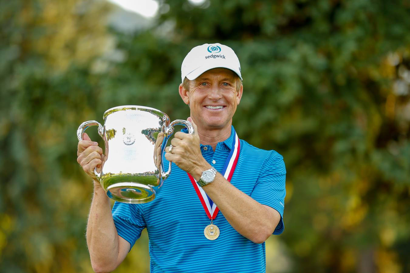 David Toms Smiling With Trophy Background