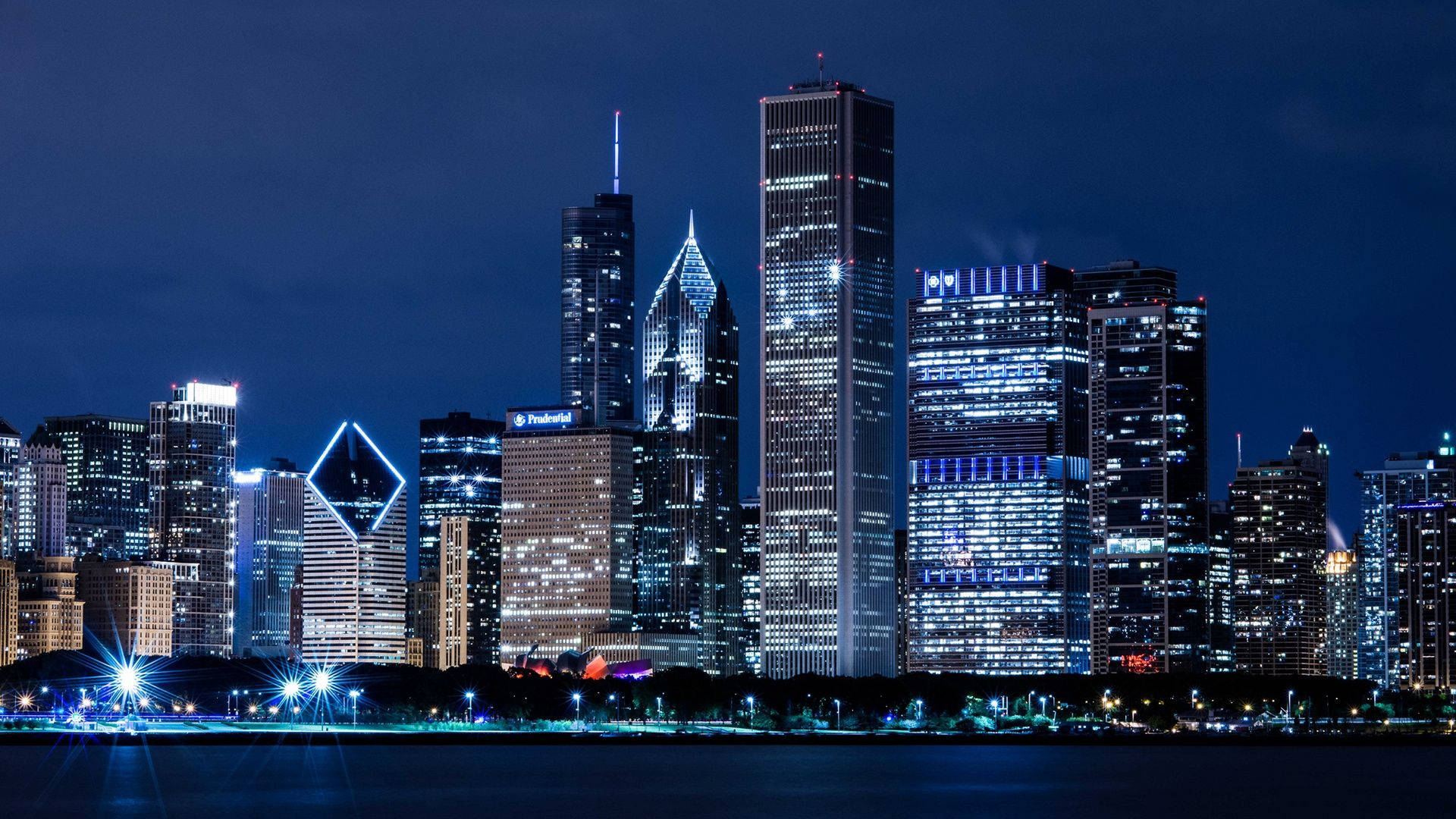 Dazzling Chicago Buildings At Night Background