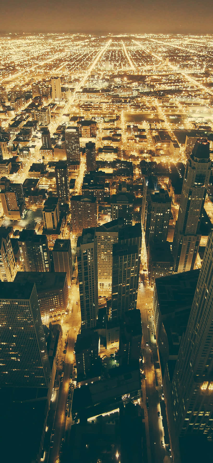 Dazzling Lights Illuminate The City Of Chicago At Night Background