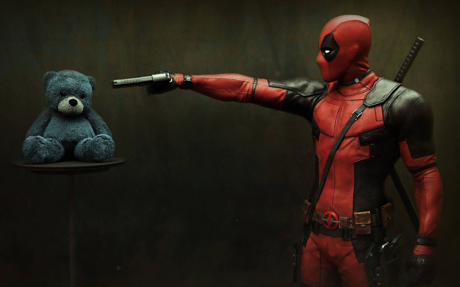 Deadpool Pointing His Gun At Teddy Background