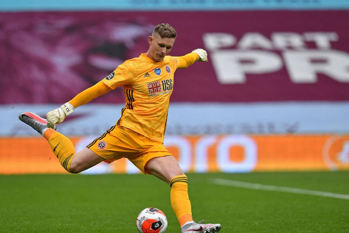 Dean Henderson Kicking Football Background