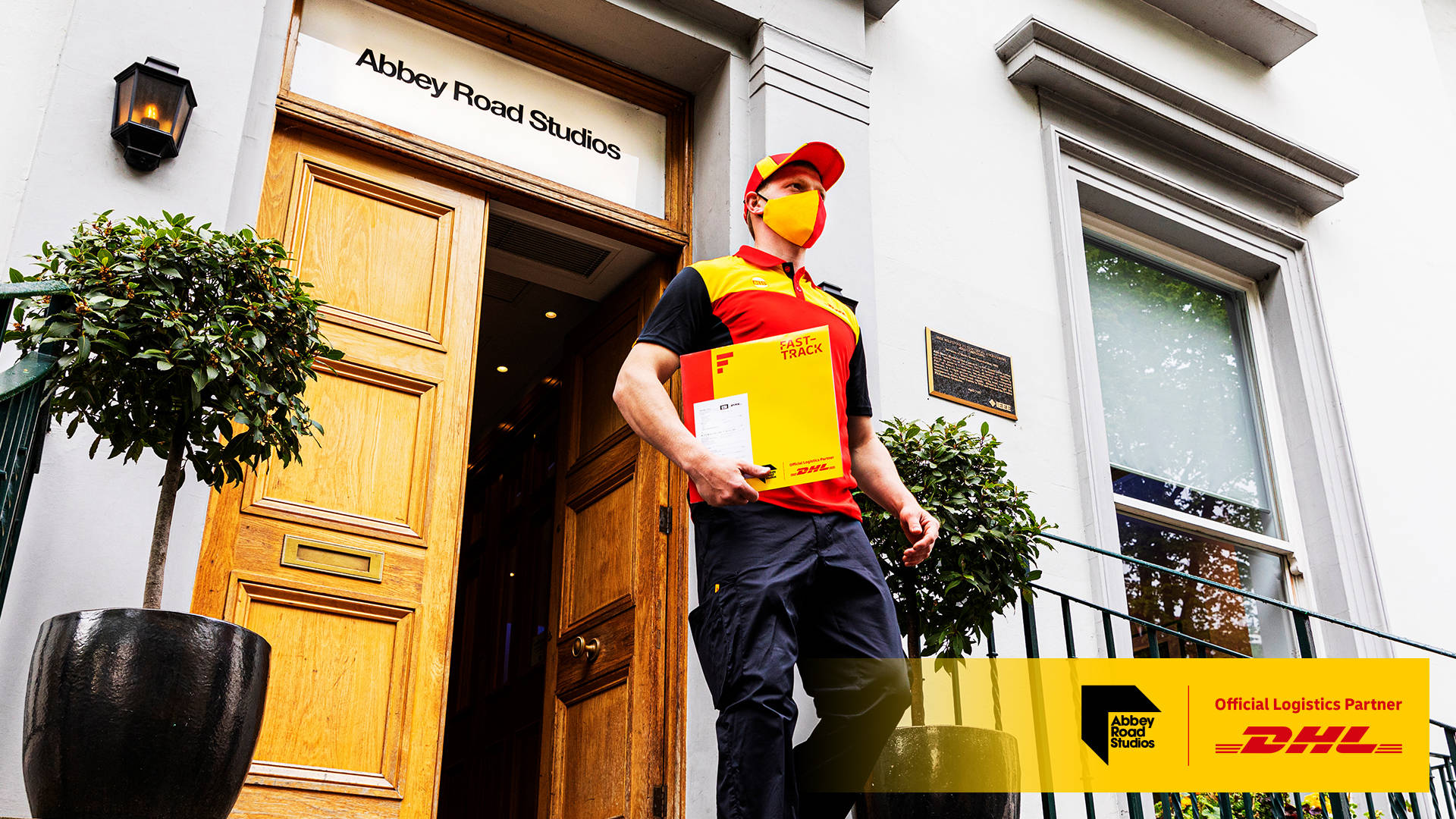 Dedicated Dhl Courier In Action Background