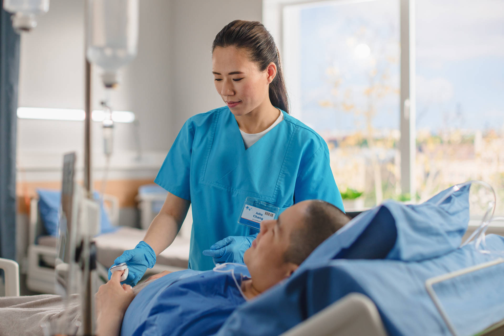 Dedicated Female Nurse Assisting Male Patient Background