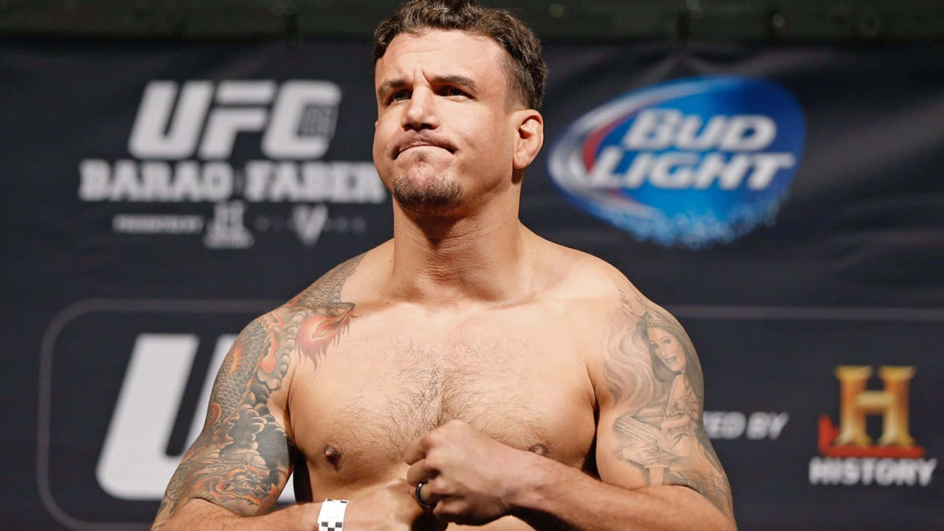 Dedicated Fighter - Frank Mir With His Iconic Tattoos Background