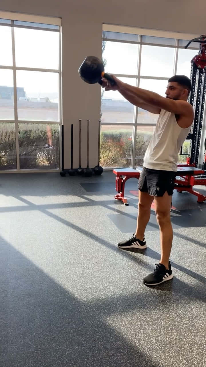 Dedicated Mma Fighter Amir Albazi Training With Arm Weights