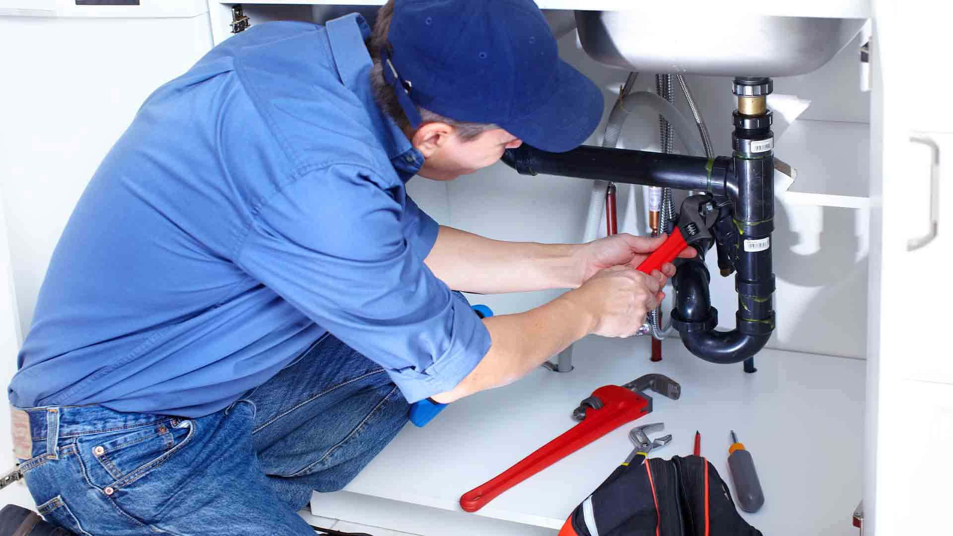 Dedicated Professional Plumber At Work