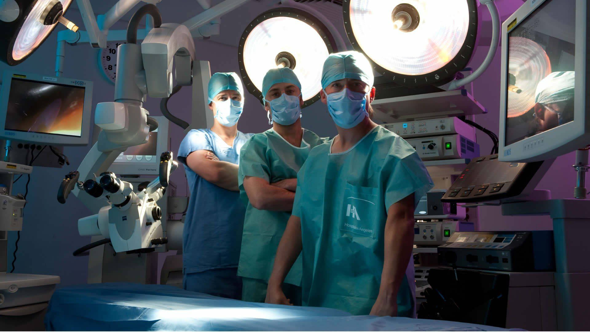 Dedicated Surgeons Performing A Surgery In A High-tech Hospital Operating Room Background