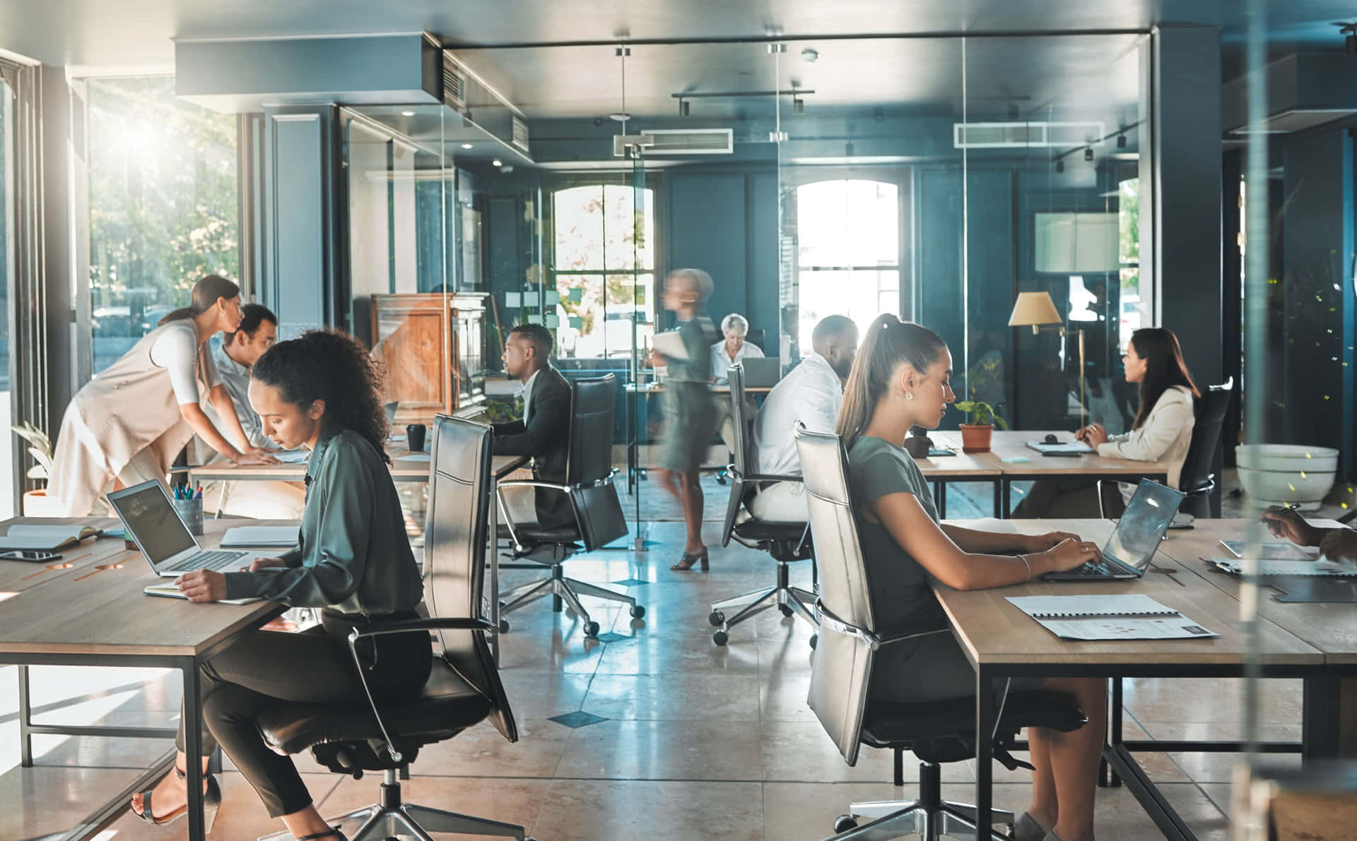 Dedicated Team In A Modern Industrial Office Background
