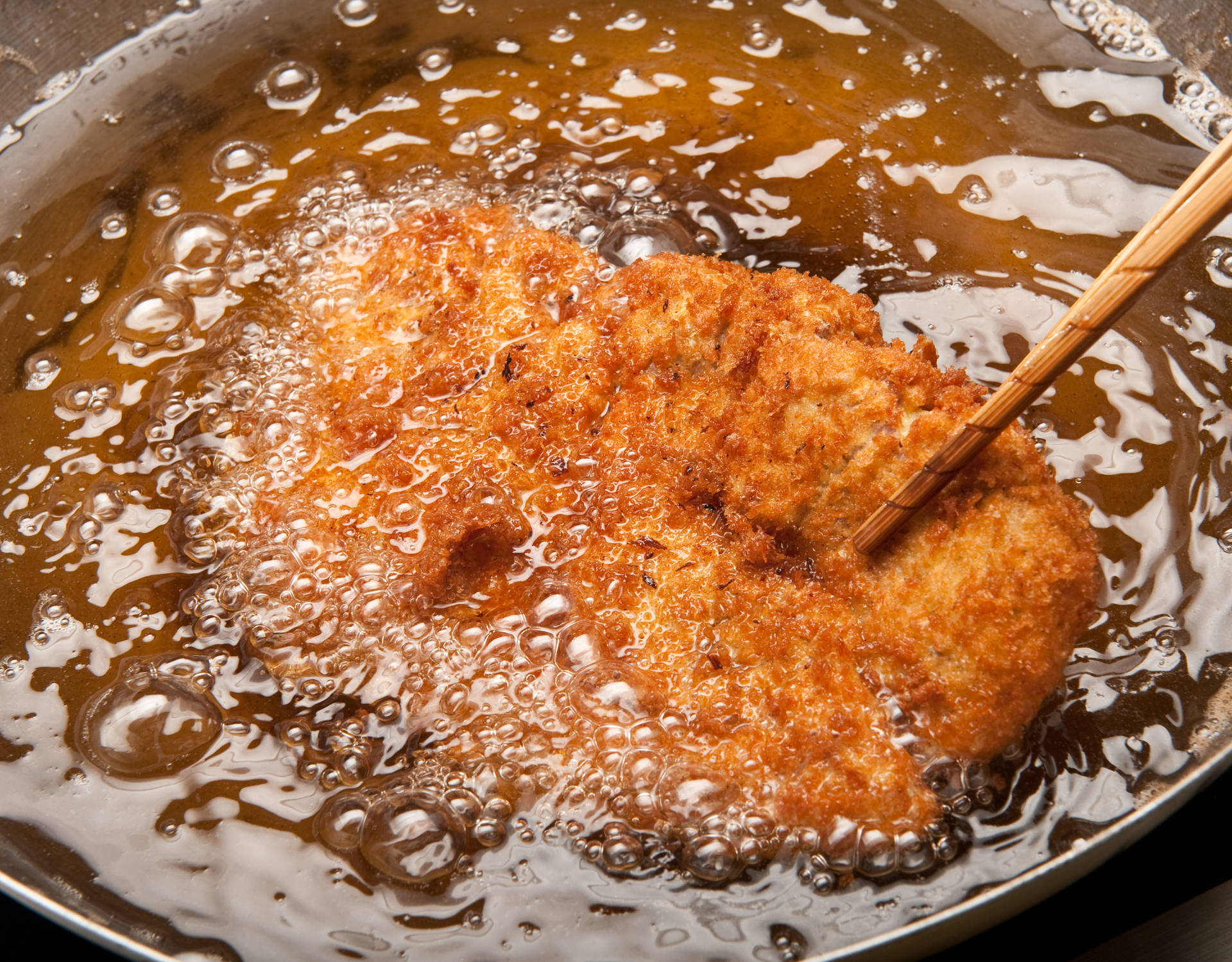 Deep Frying A Tonkatsu Background