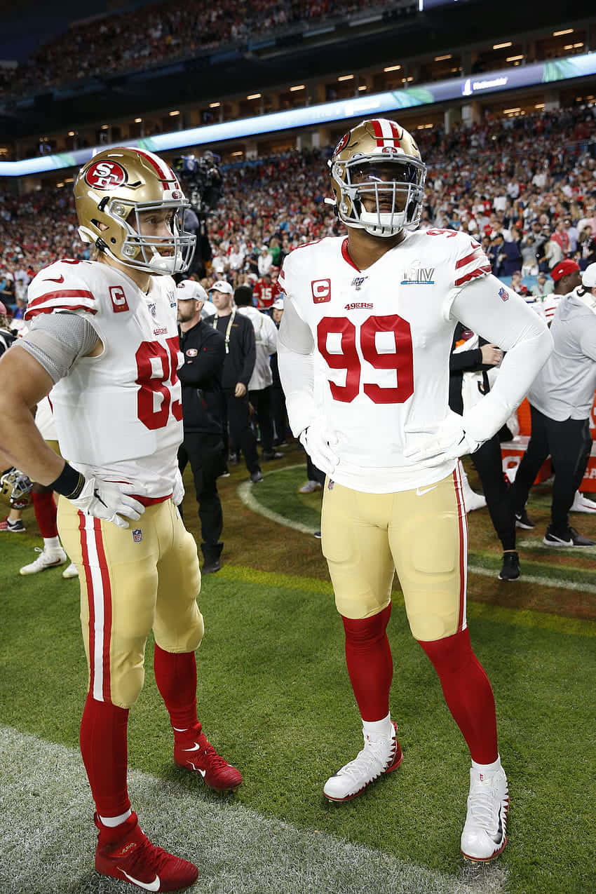 Deforest Buckner And George Kittle - Power Players Of Nfl Background