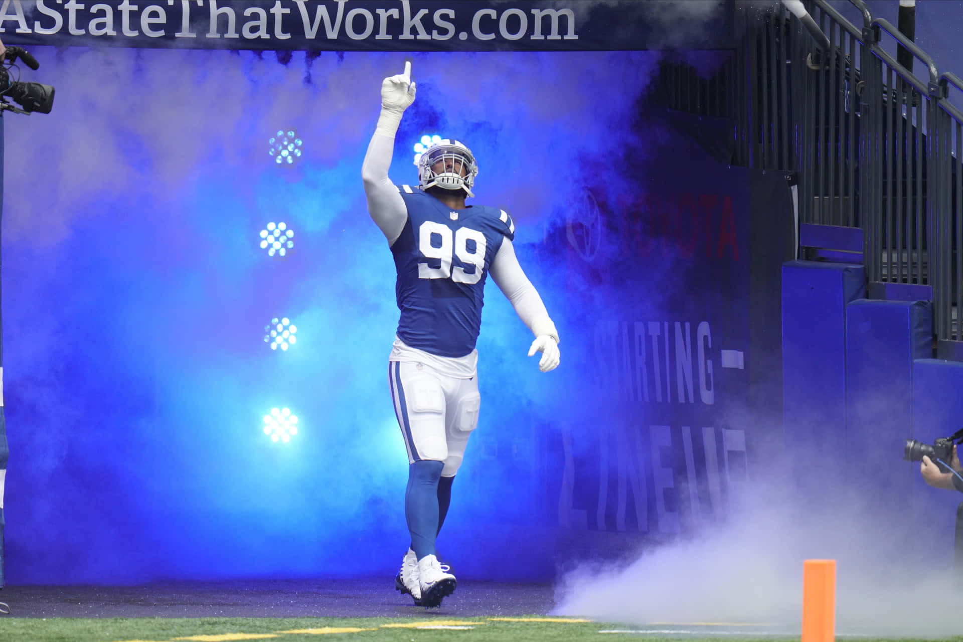 Deforest Buckner Blue Smoke On Field Entrance Background