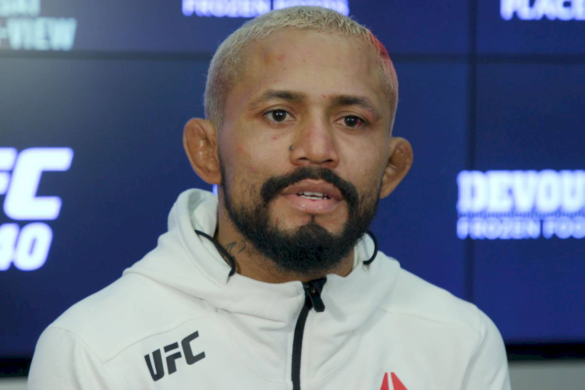 Deiveson Figueiredo In White Ufc Jacket Background