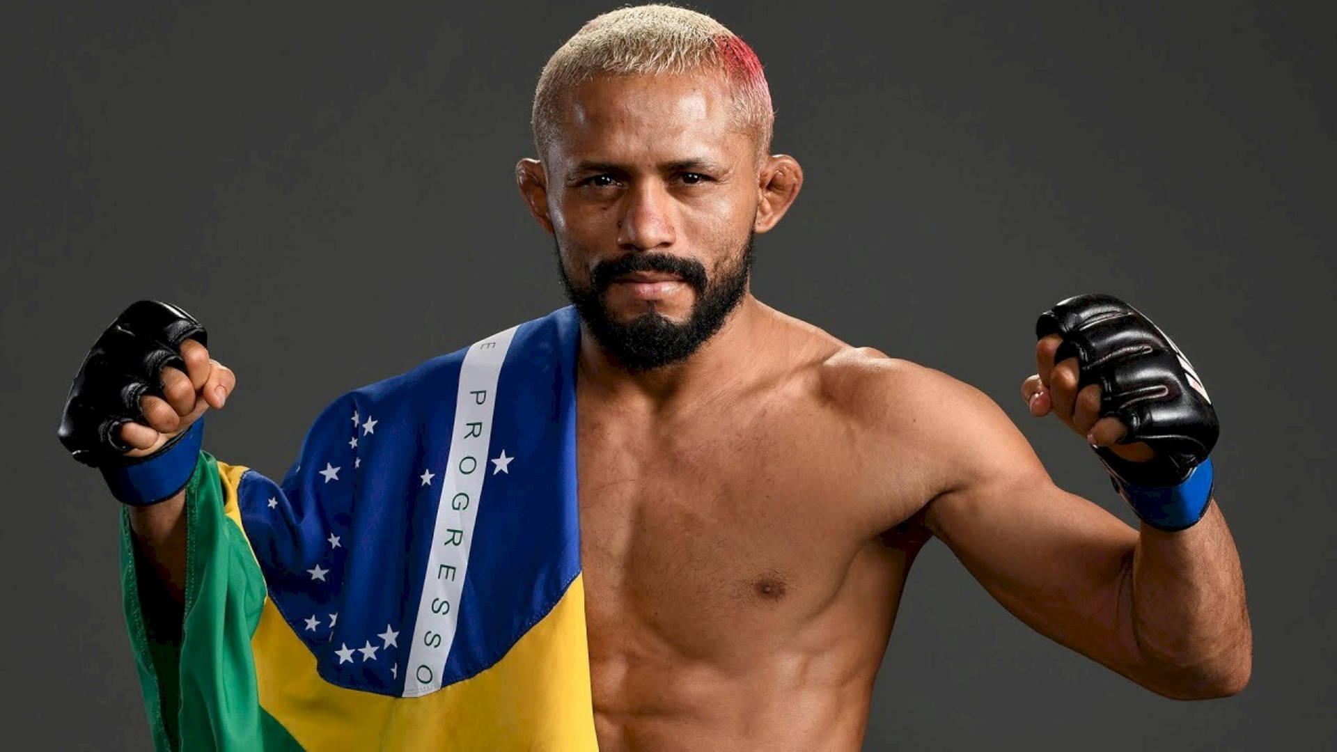 Deiveson Figueiredo Posing With Brazilian Flag Background