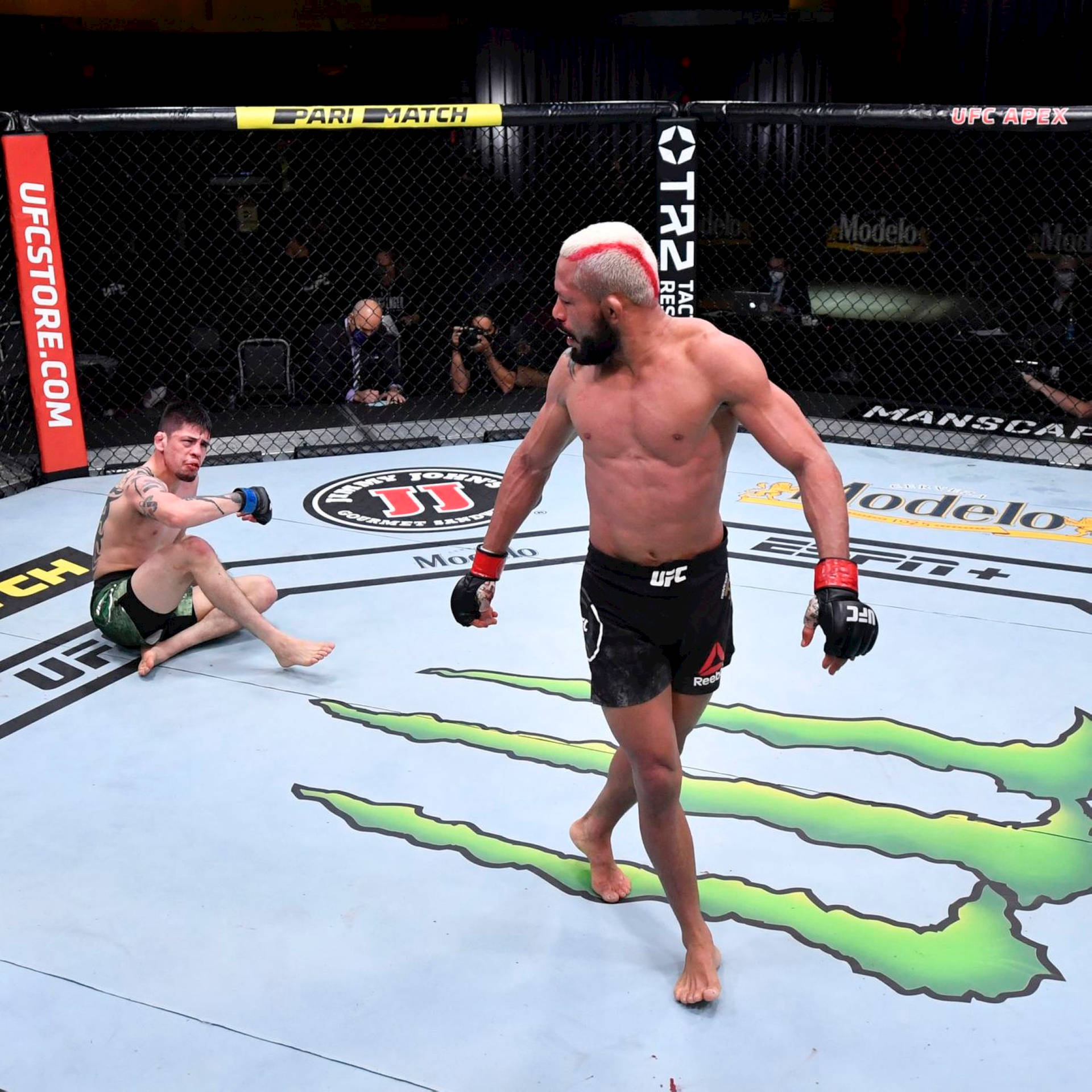 Deiveson Figueiredo Walking Away From Opponent Background