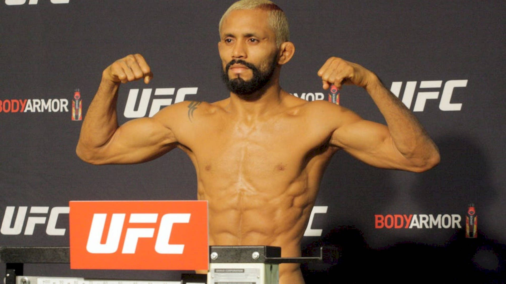 Deiveson Figueiredo With Ufc Logo Background