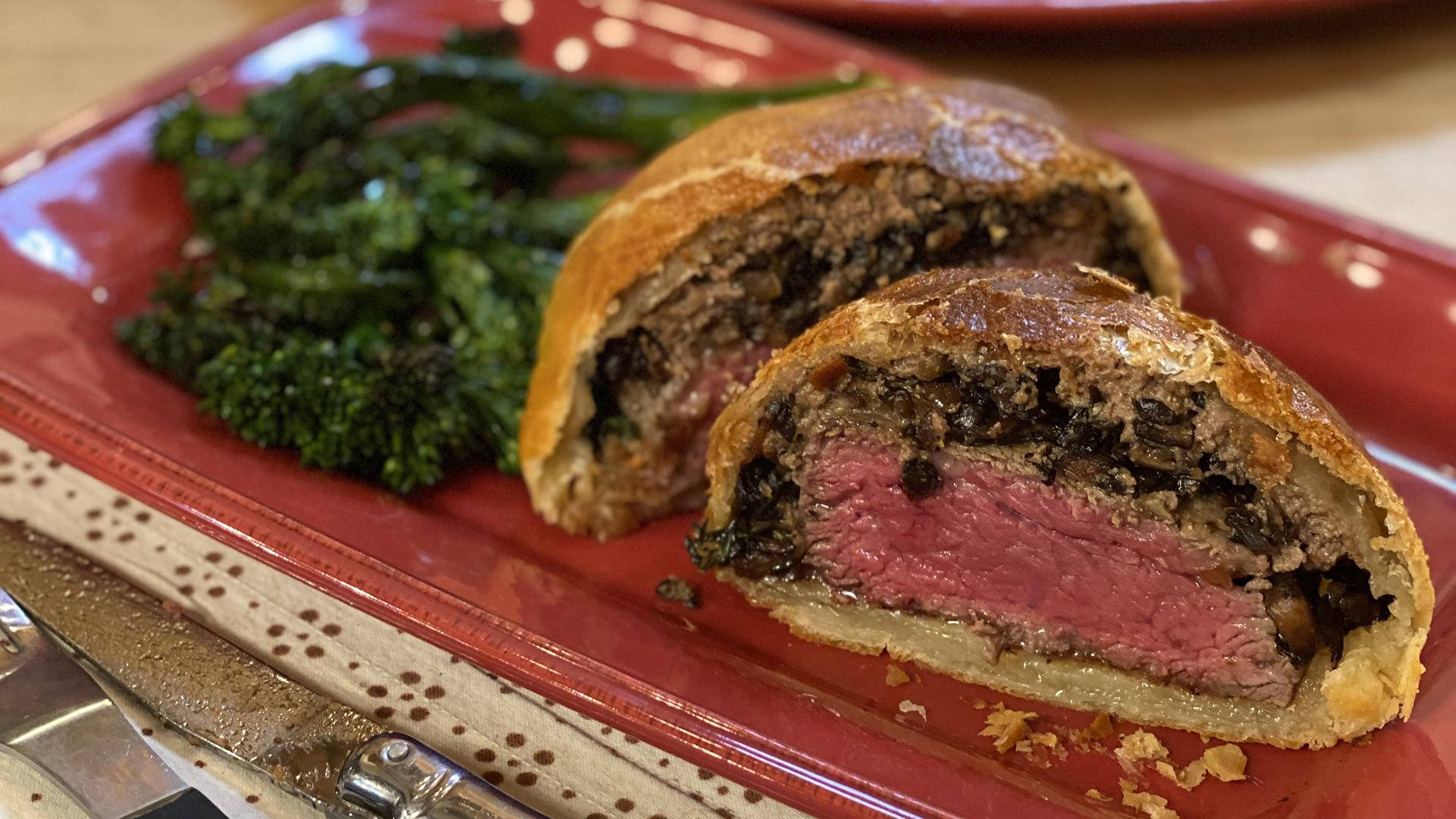 Delectable Beef Wellington Served With Fresh Vegetables Background