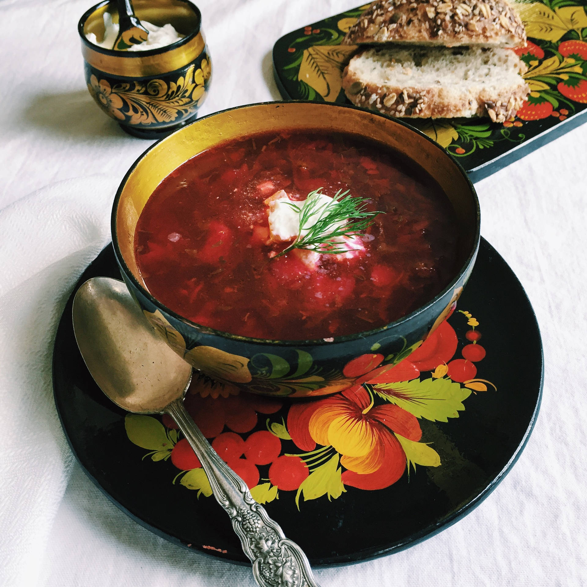 Delectable Borscht Soup Served With Crust Wheat Bread Background