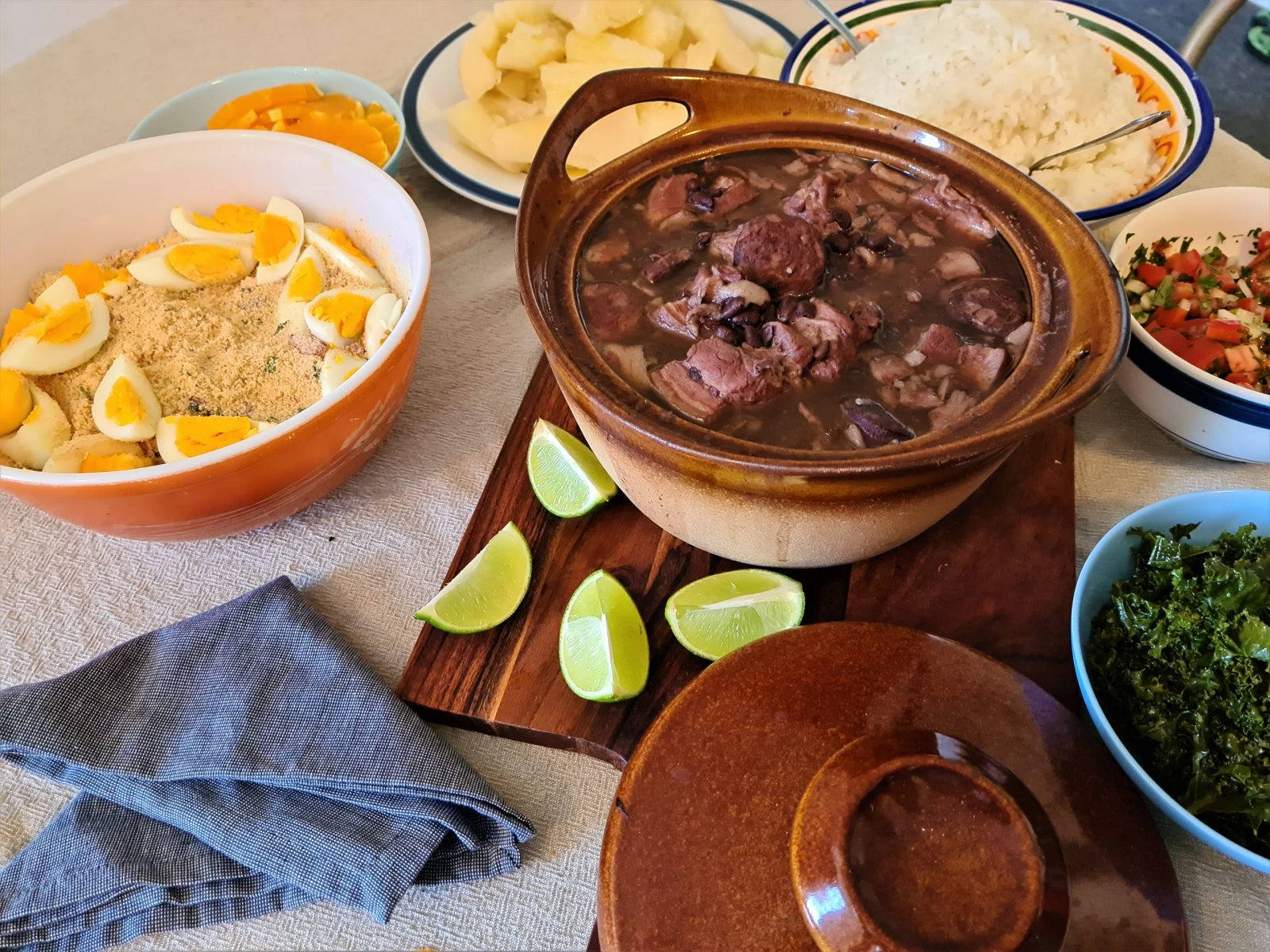 Delectable Brazilian Feijoada With Flavorful Garnishings Background