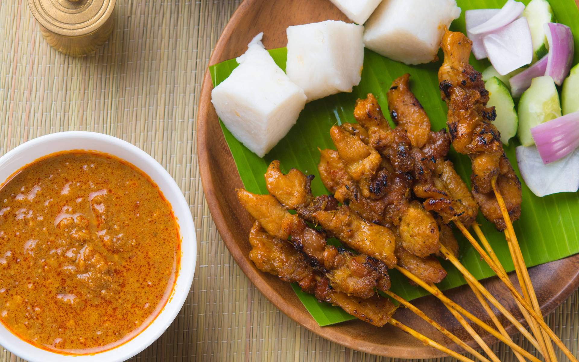 Delectable Chicken Satay On A Rustic Wooden Bowl Background