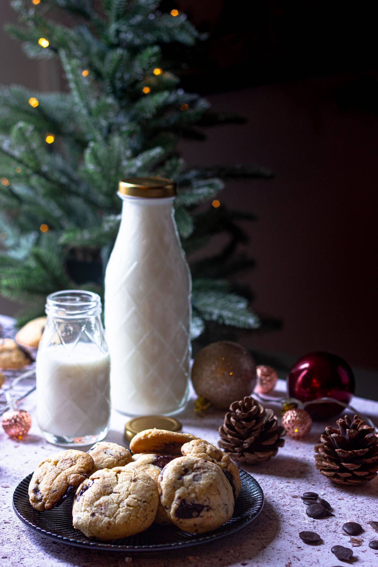 Delectable Christmas Cookies Paired Perfectly With Milk Background