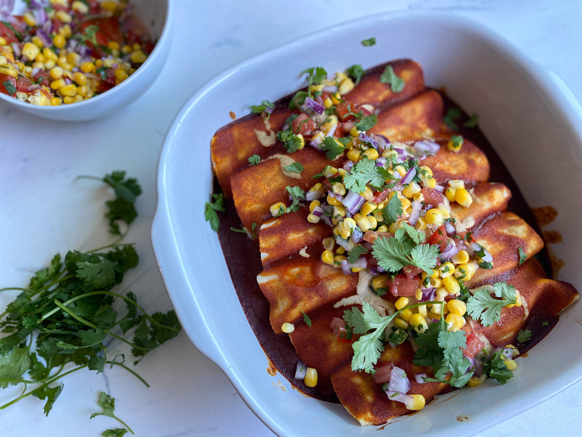 Delectable Enchiladas Topped With Fresh Vegetables Background