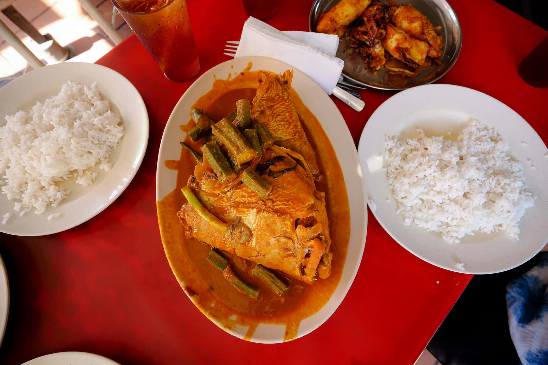 Delectable Fish Head Curry Served With Rice Background