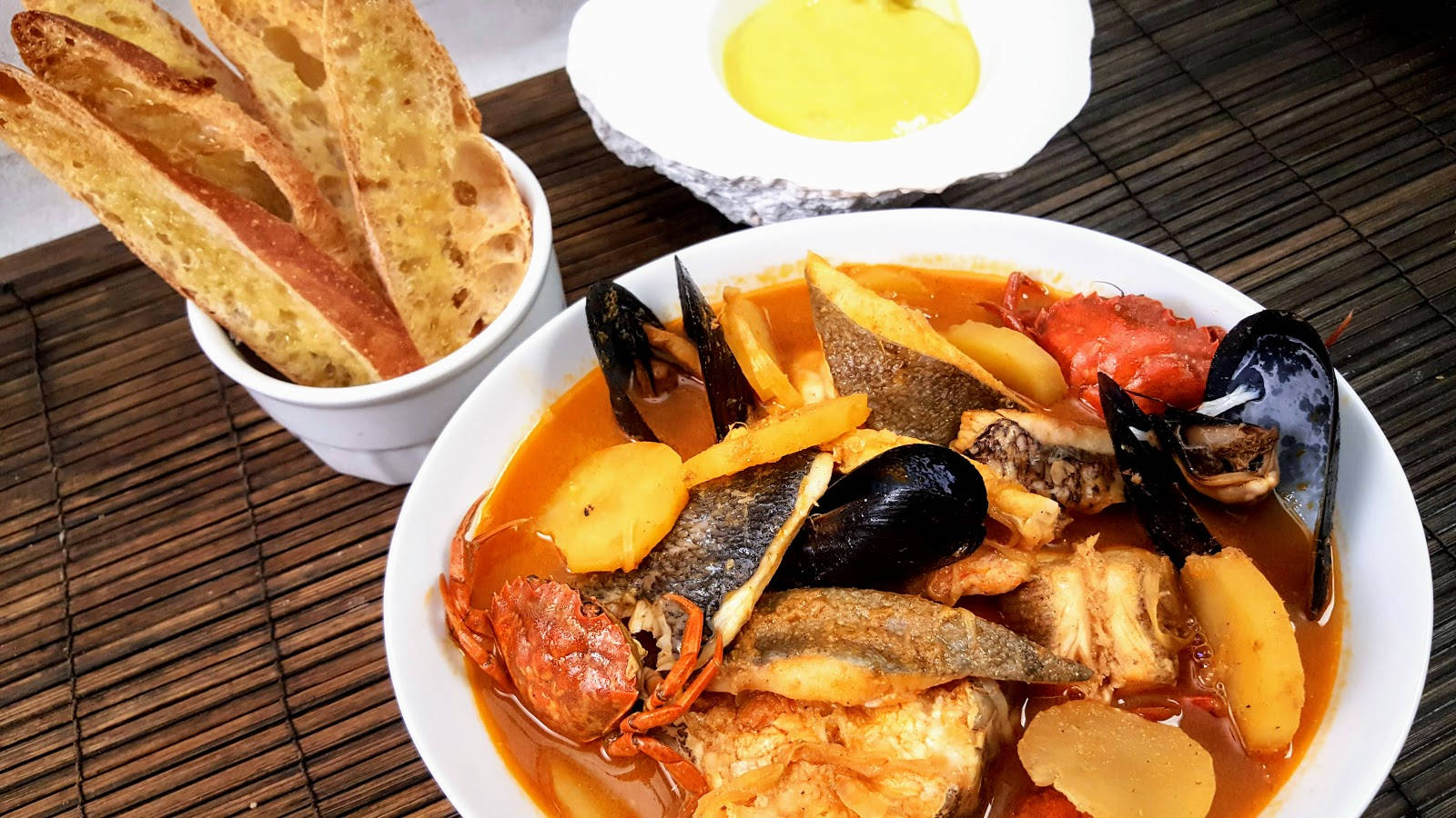 Delectable French Bouillabaisse Dish On Bamboo Mat Background