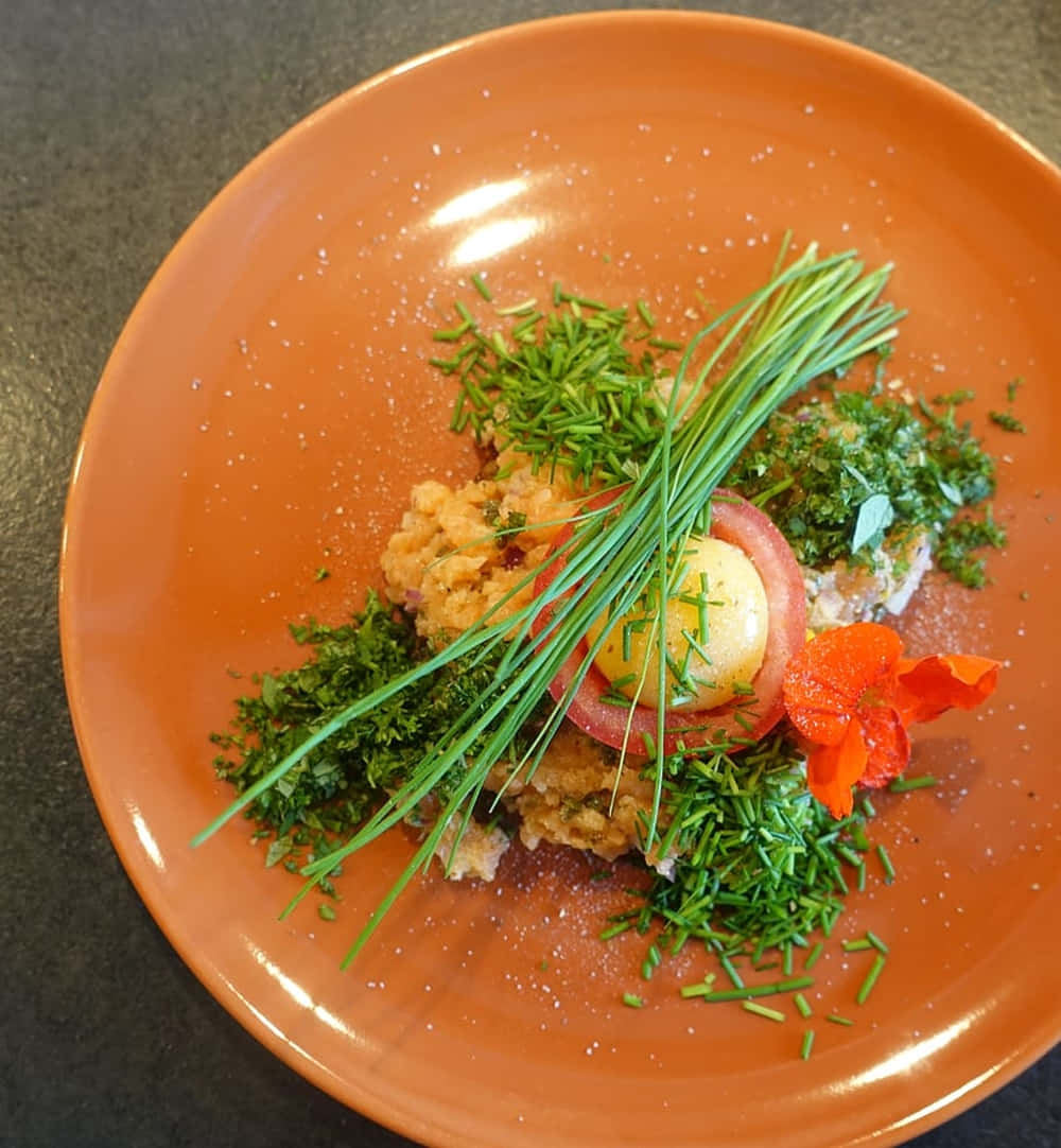 Delectable Ground Salmon Dish Garnished With Green Chives Background