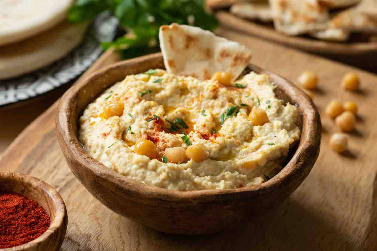 Delectable Hummus With Pita Bread And Chickpeas Background