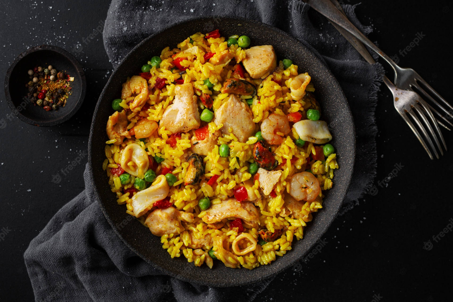 Delectable Seafood Paella With Vibrant Yellow Rice Background