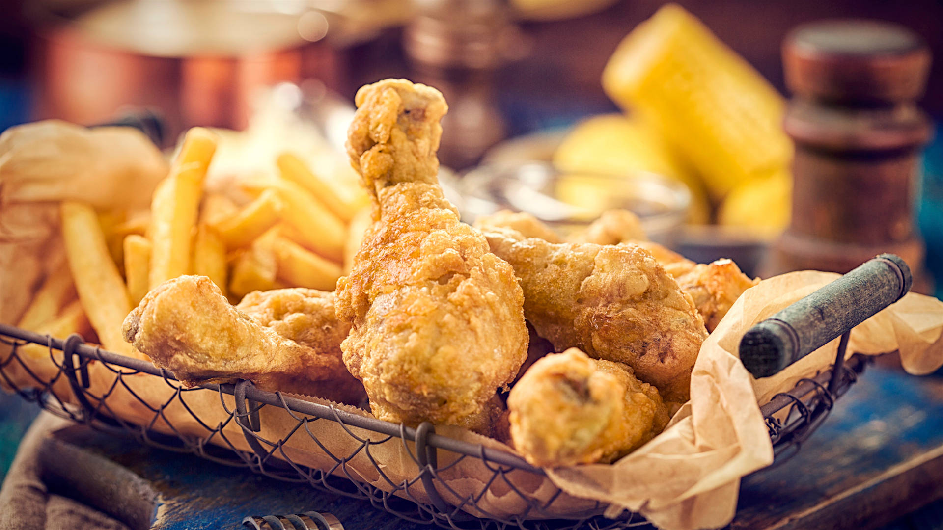 Delectable Sheesh Fried Chicken Served With Crispy Potato Fries Background