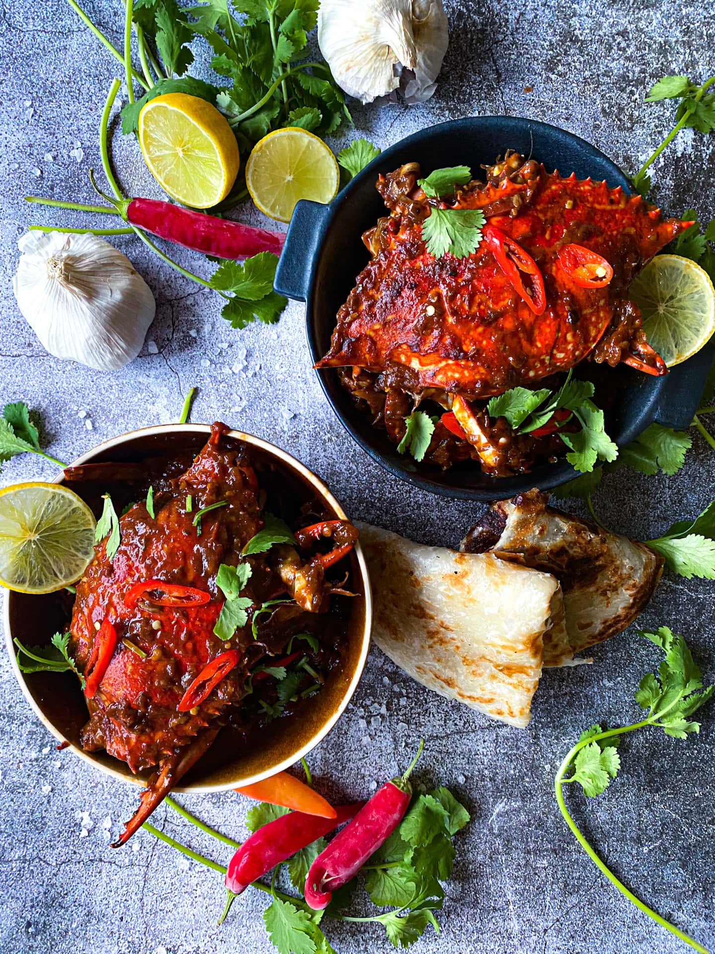 Delectable Singapore Chilli Crab In Two Bowls Background