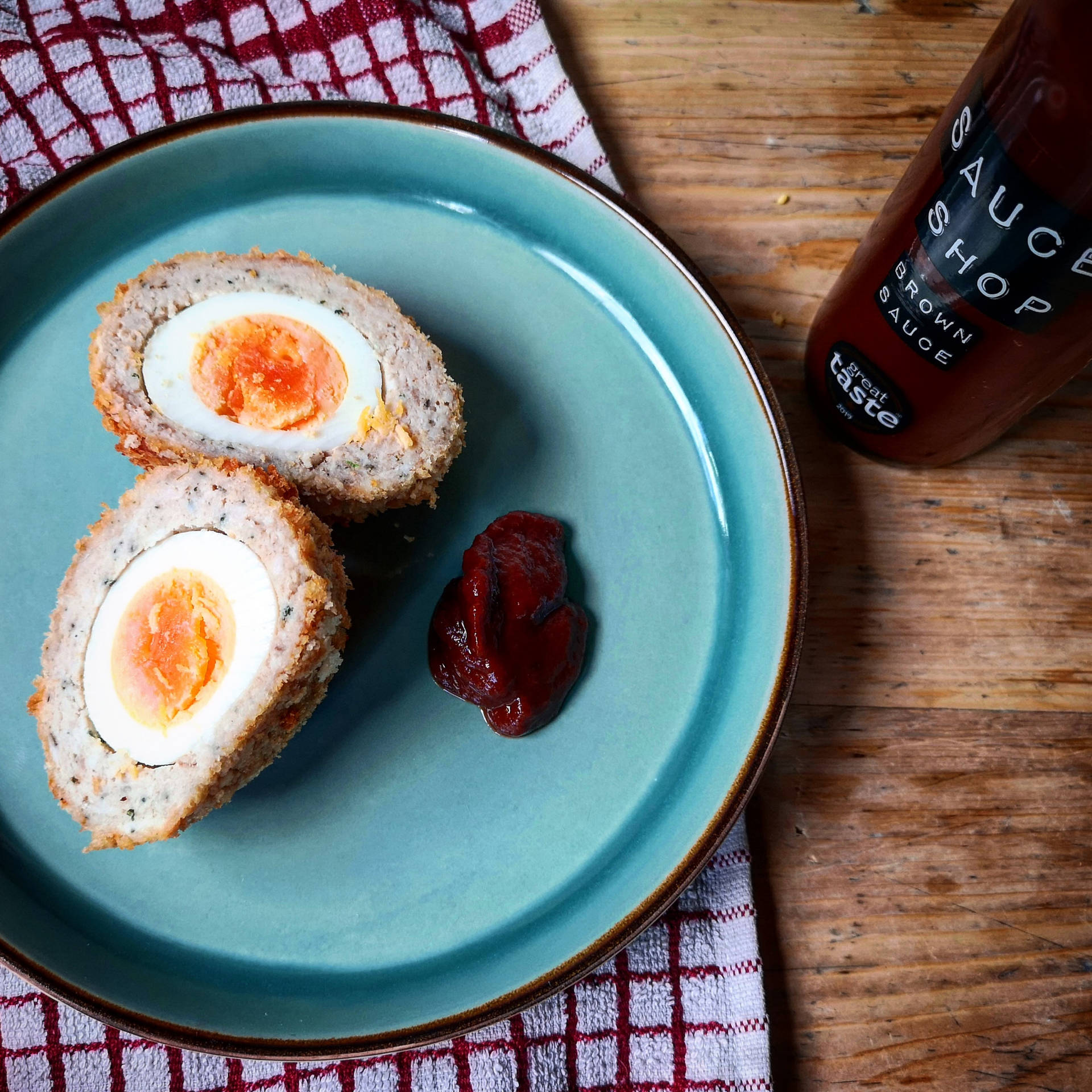 Delectable Traditional British Scotch Egg With Brown Sauce Background