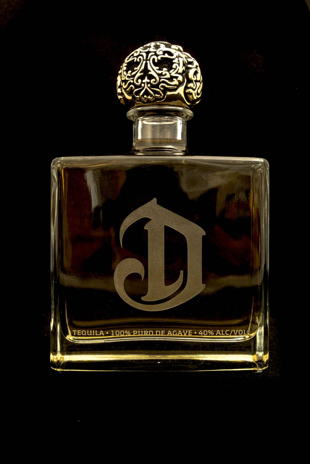 Deleón Tequila Dark Golden Bottle Background