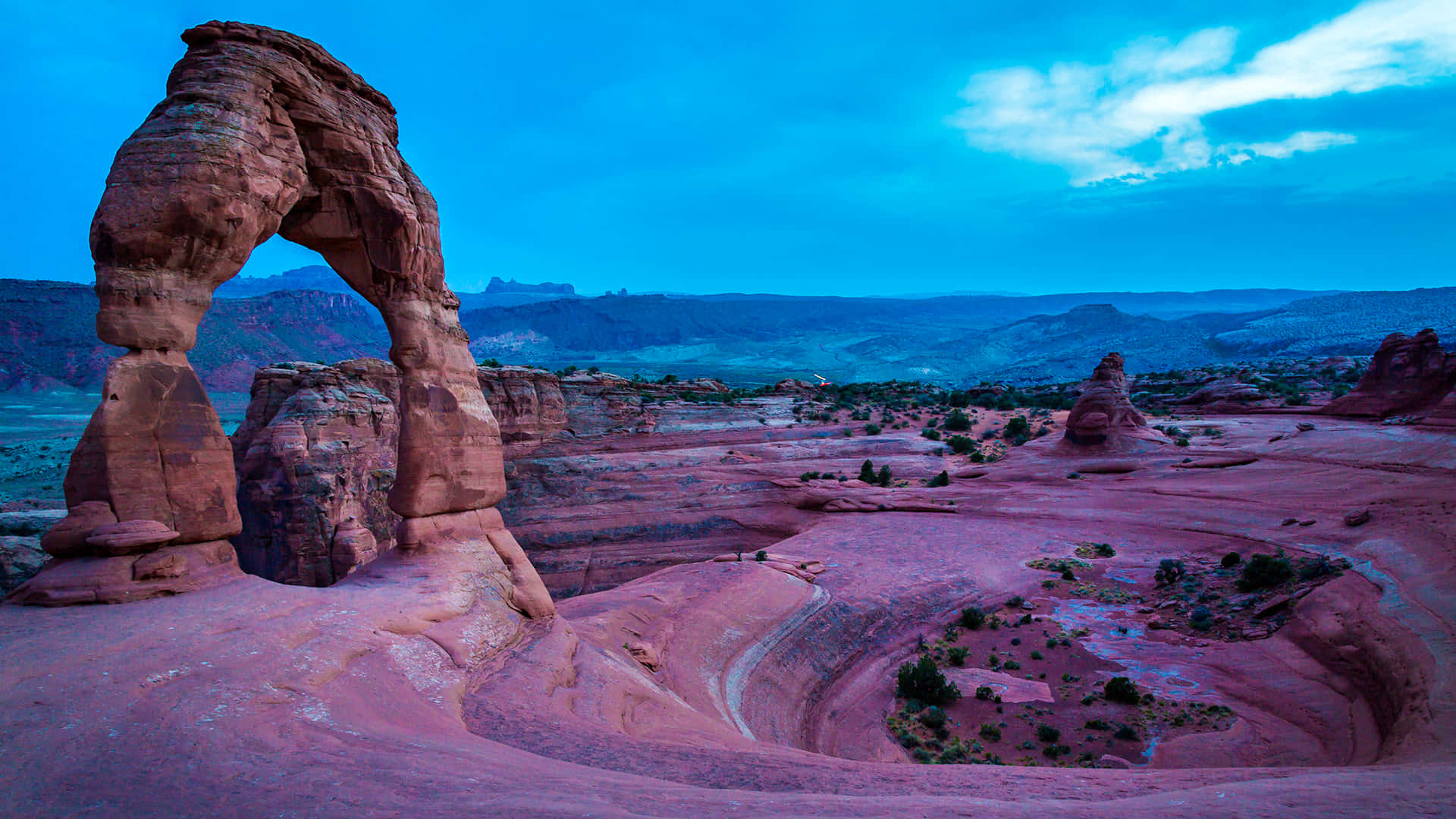 Delicate Arch View Under Blue Sky Background