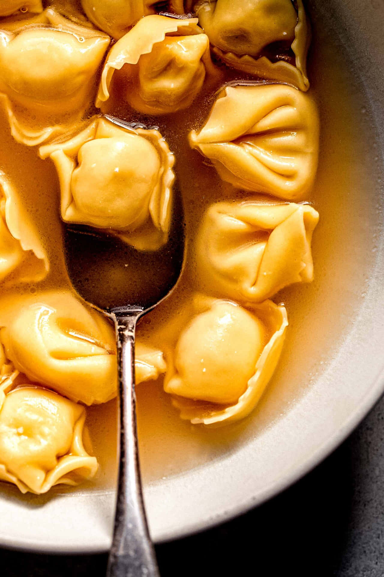 Delicate, Authentic Italian Tortellini In Brodo Soup Background