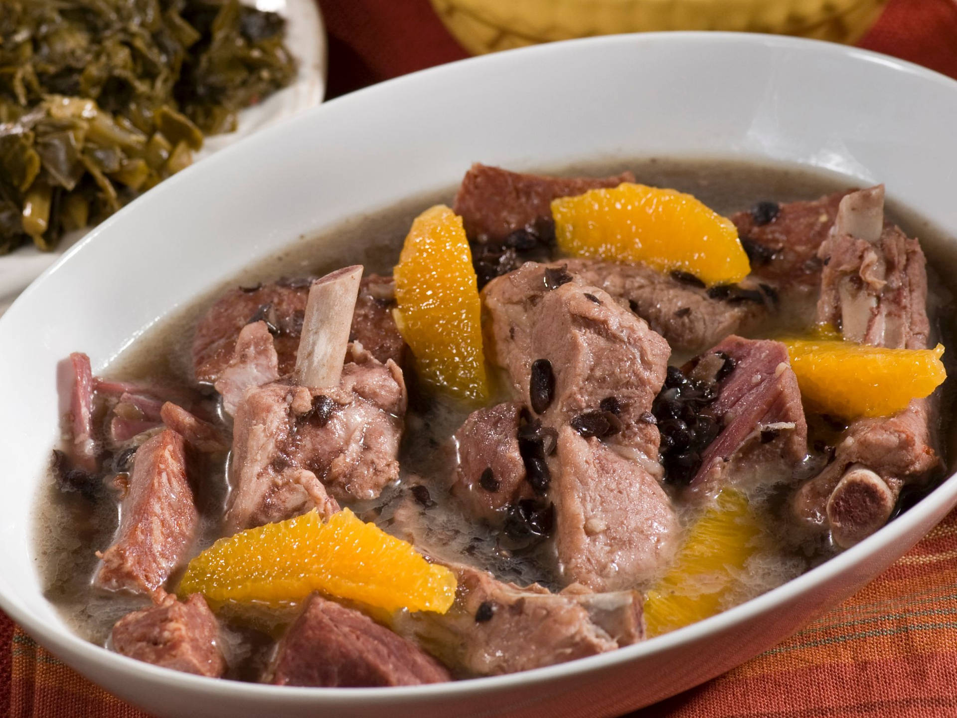 Delicious Brazilian Feijoada Stew Served In A White Bowl Background