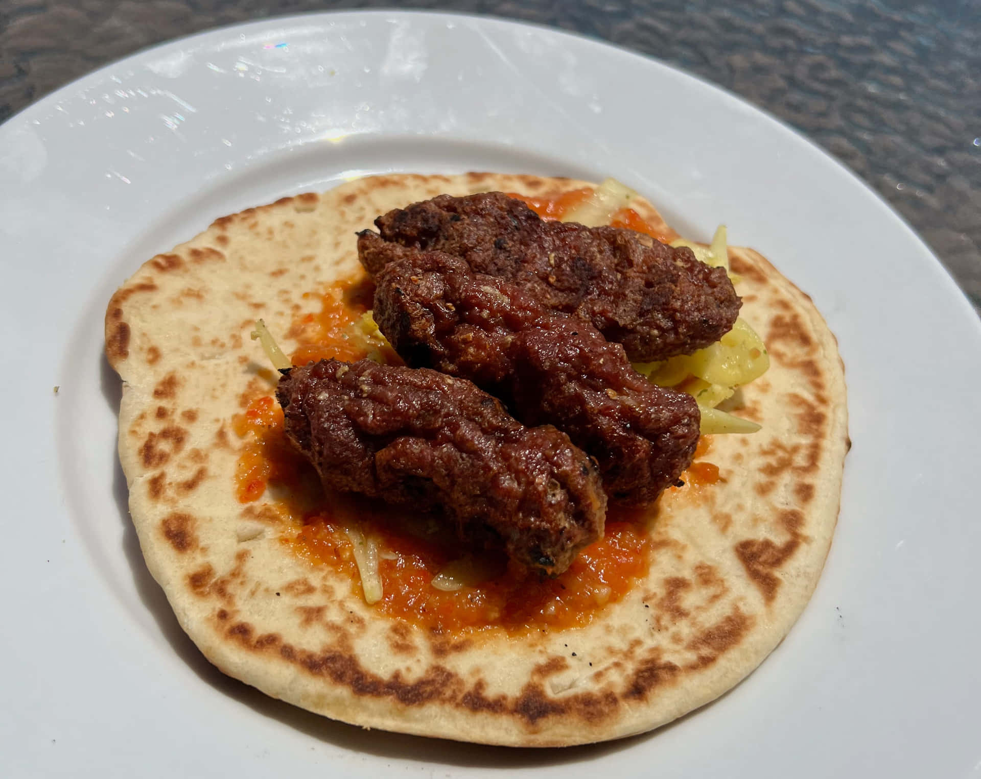 Delicious Ćevapi Sausages Served On Fluffy Pita Bread Background