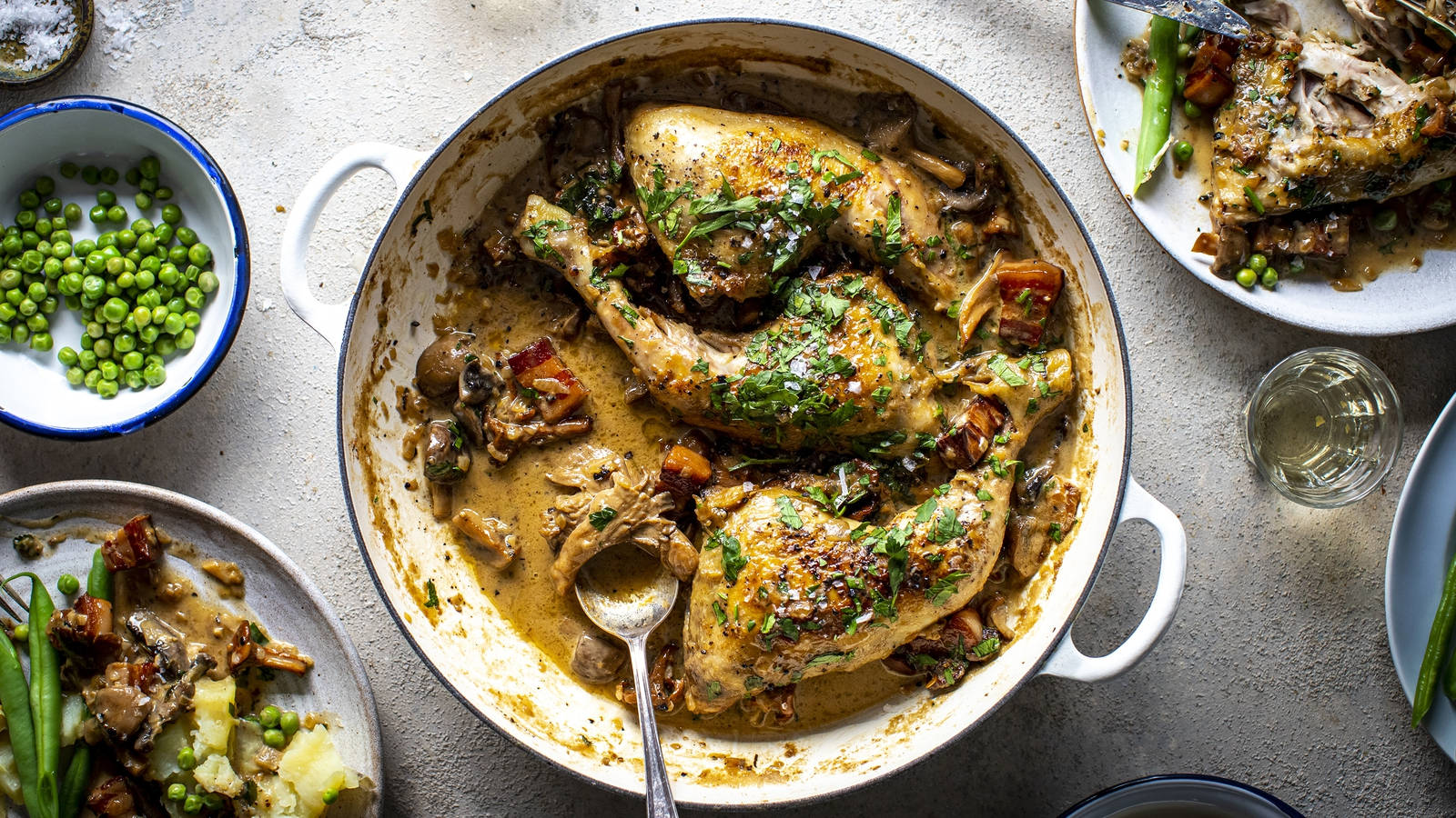 Delicious Coq Au Vin In Cooking Pot With Other Traditional French Dishes