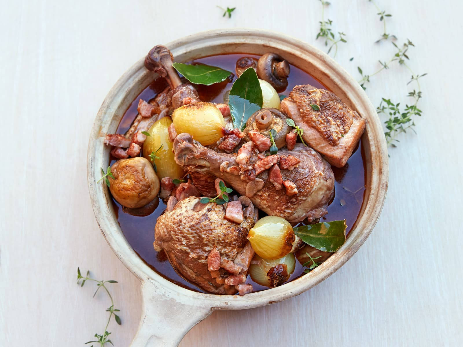 Delicious French Classic, Coq Au Vin In A Pan Background