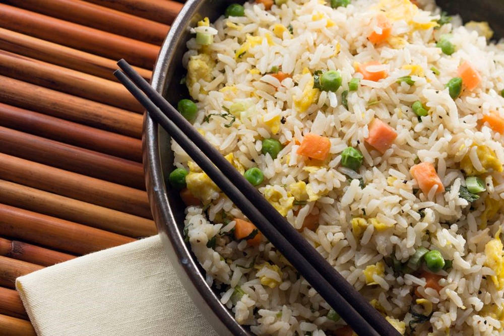 Delicious Fried Rice Served With Chopsticks