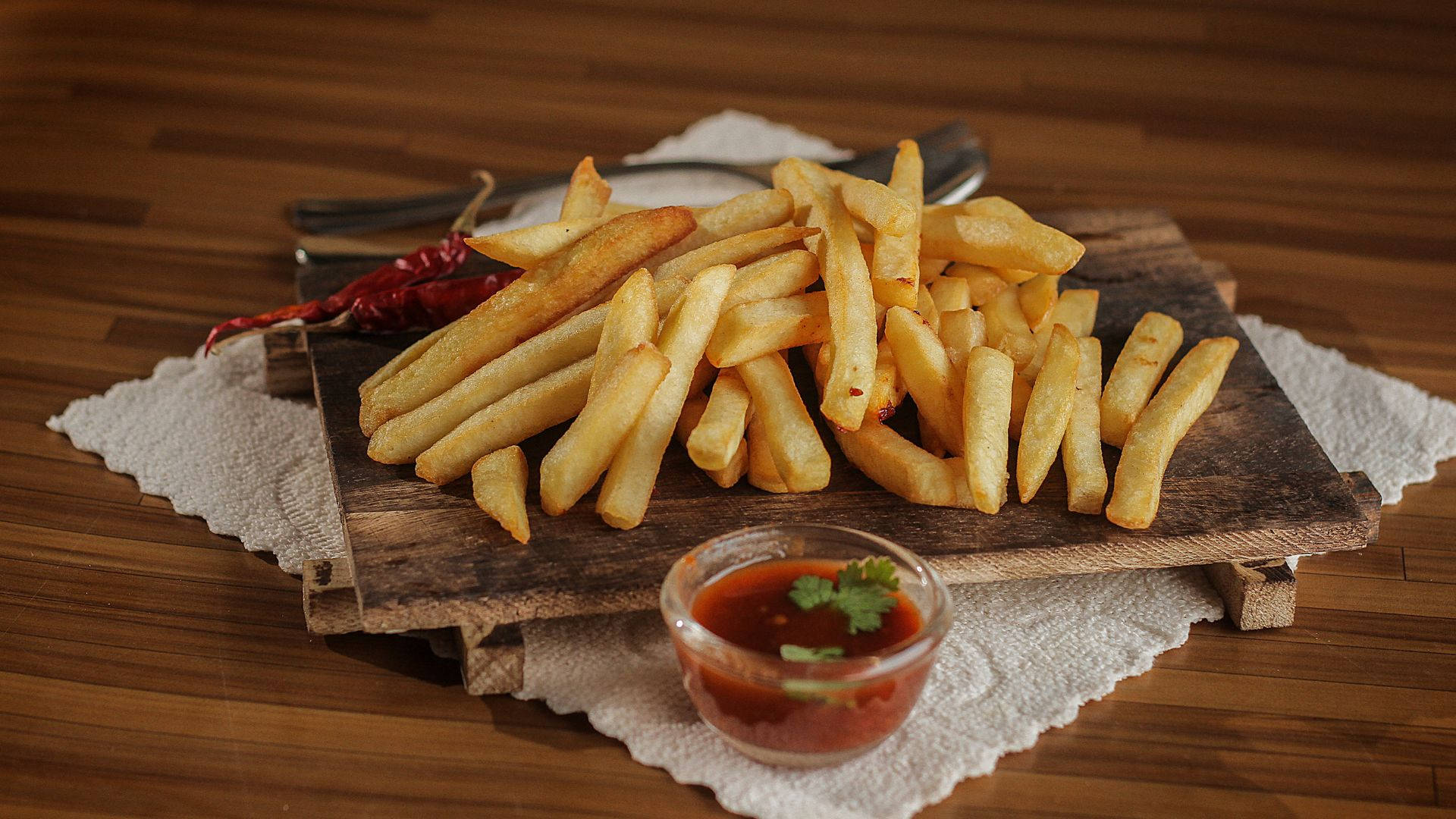 Delicious Golden French Fries On A Rustic Wooden Platter Background