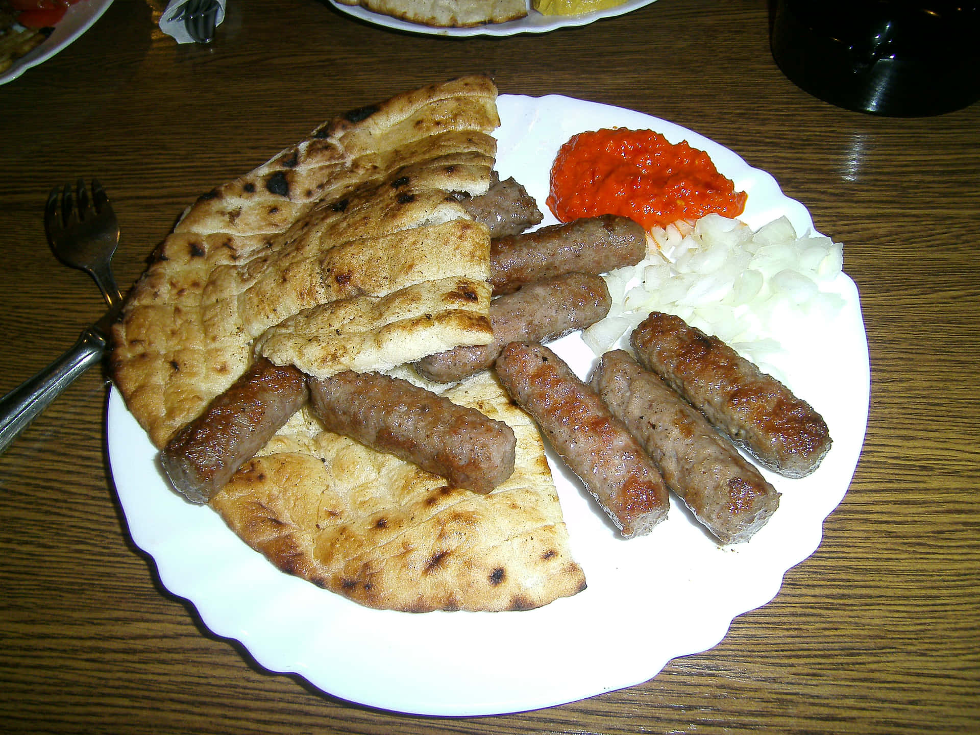 Delicious Grilled Ćevapi With Pita Bread Background