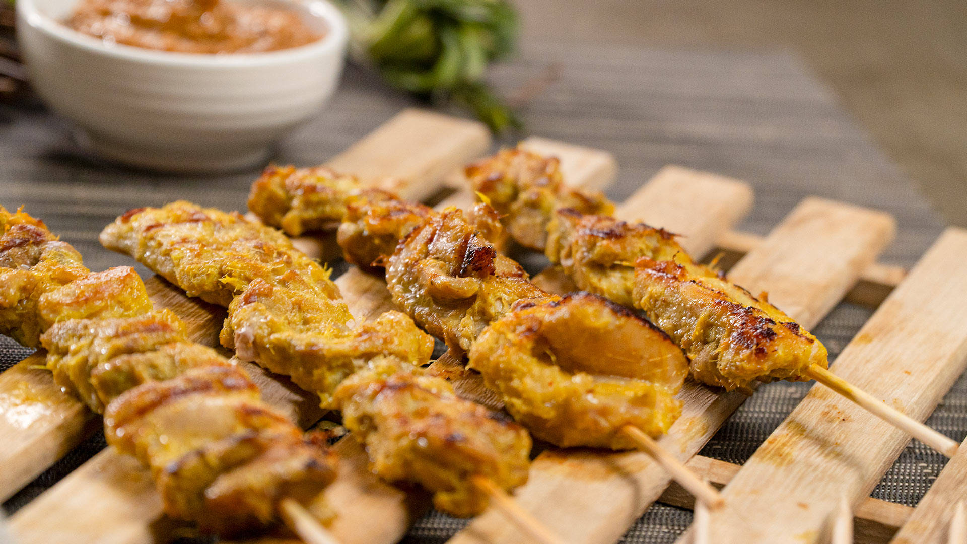 Delicious Grilled Chicken Satay With Tangy Peanut Butter Dipping Sauce Background