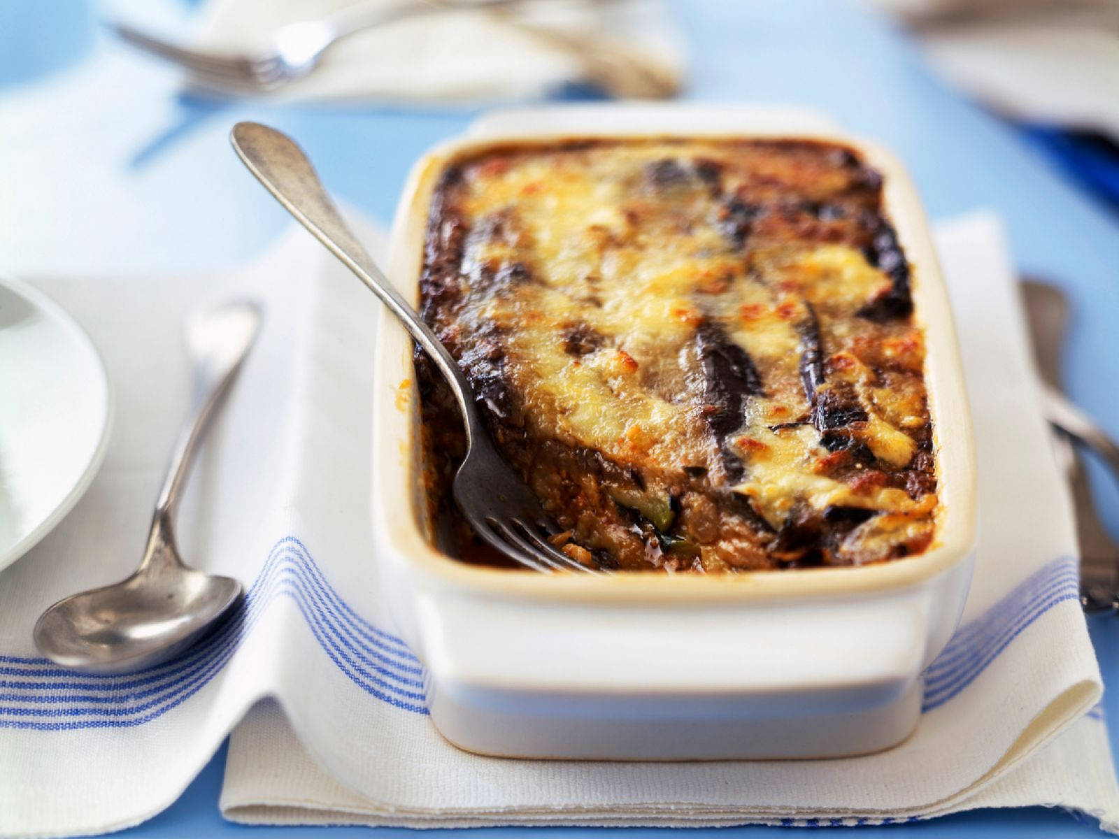 Delicious Homemade Baked Moussaka In Tupperware Background