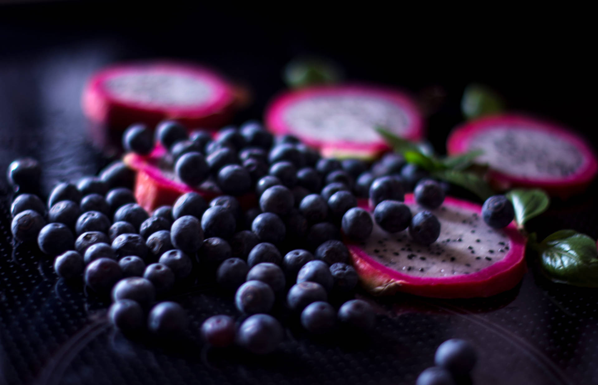 Delicious Huckleberry With Dragon Fruit Slices Background