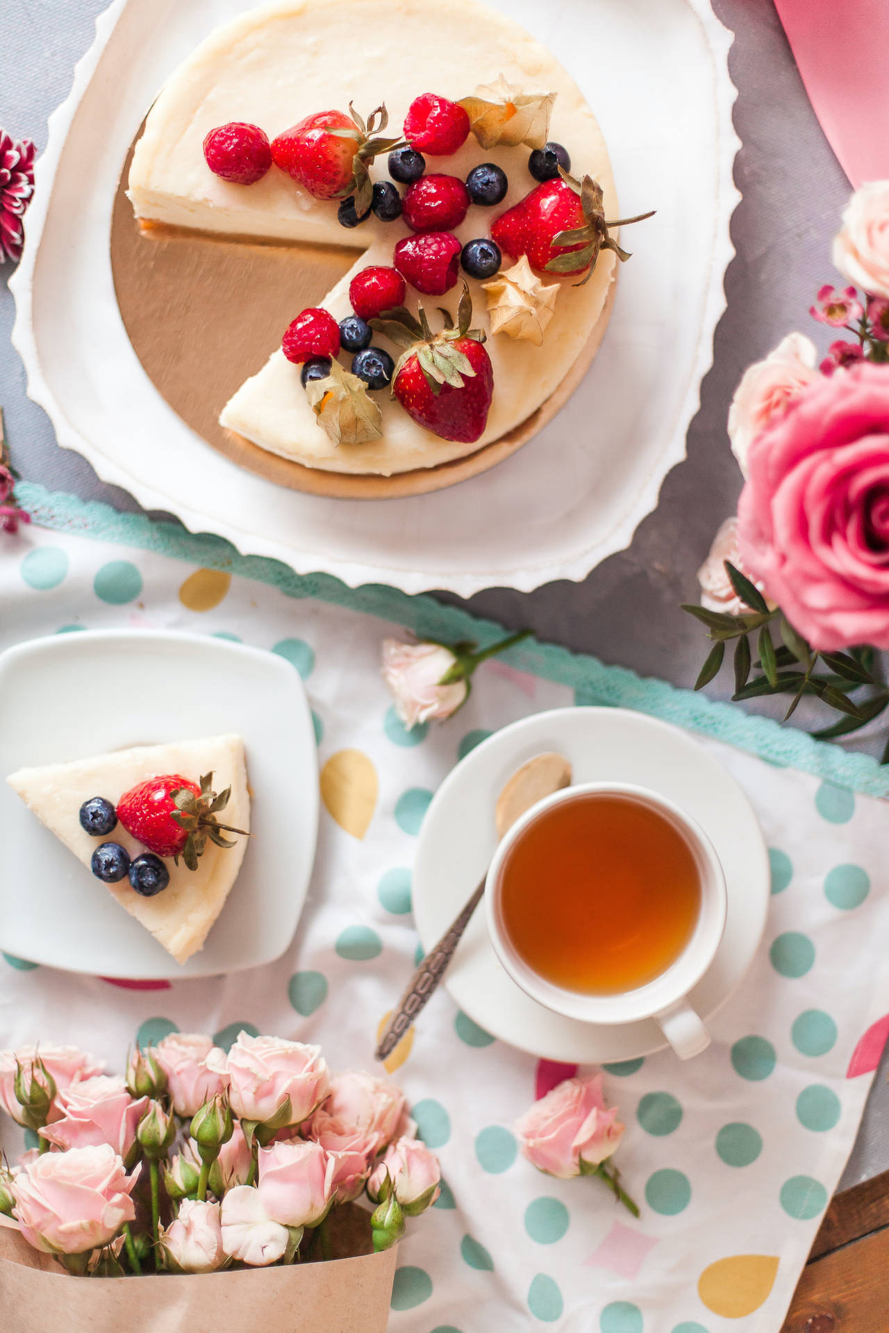 Delicious Mixed Berries Cheesecake With A Cup Of Tea Background