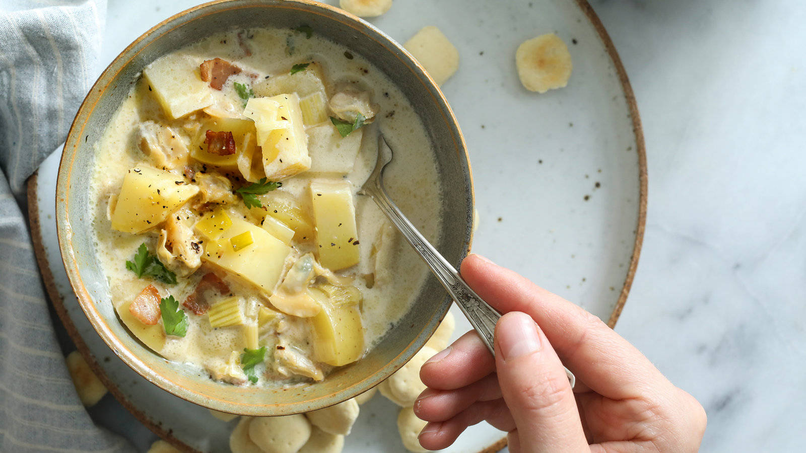 Delicious New England Clam Chowder In Chinaware Background