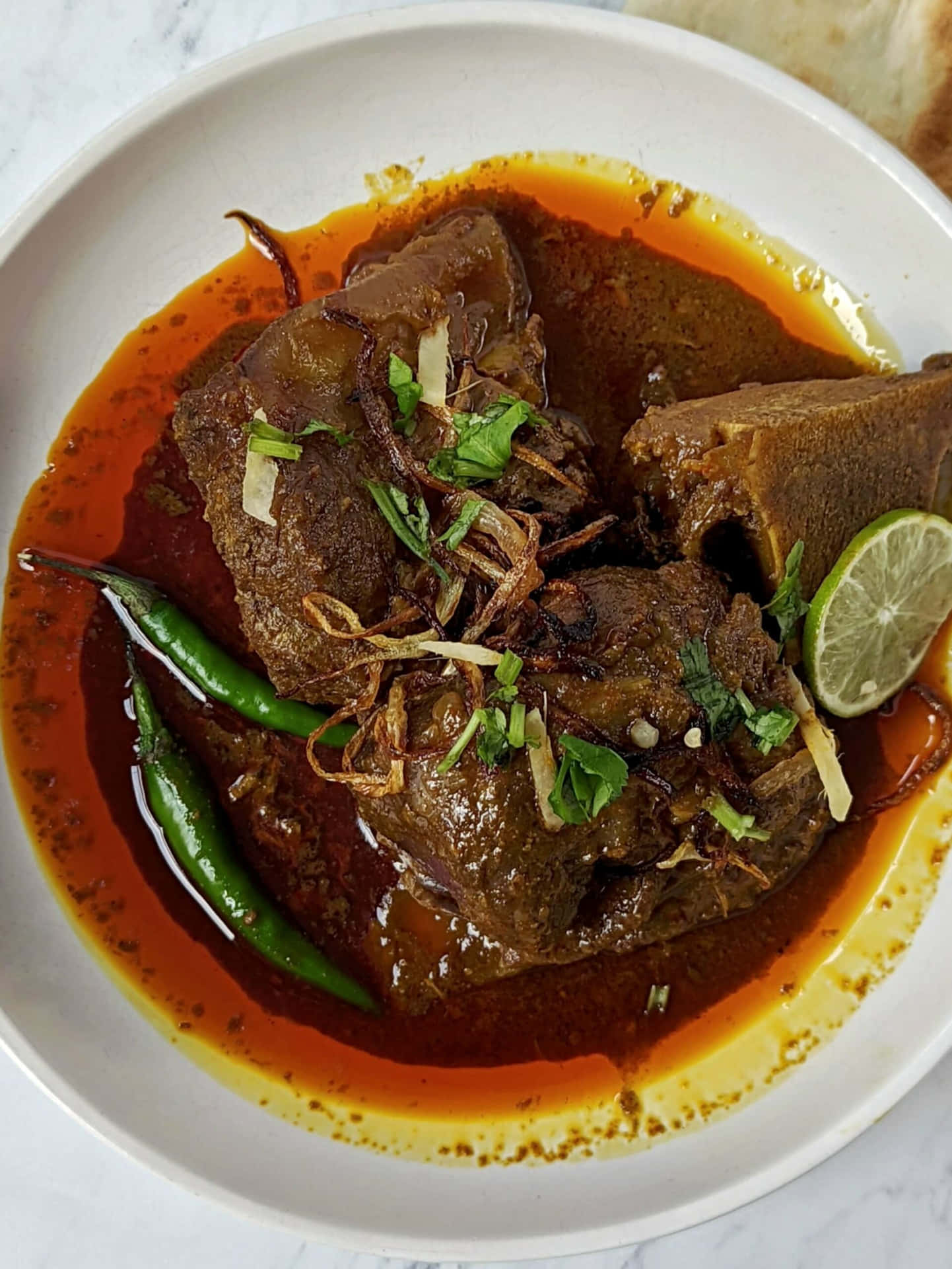 Delicious Nihari Served With Garnishing On A Wooden Table Background