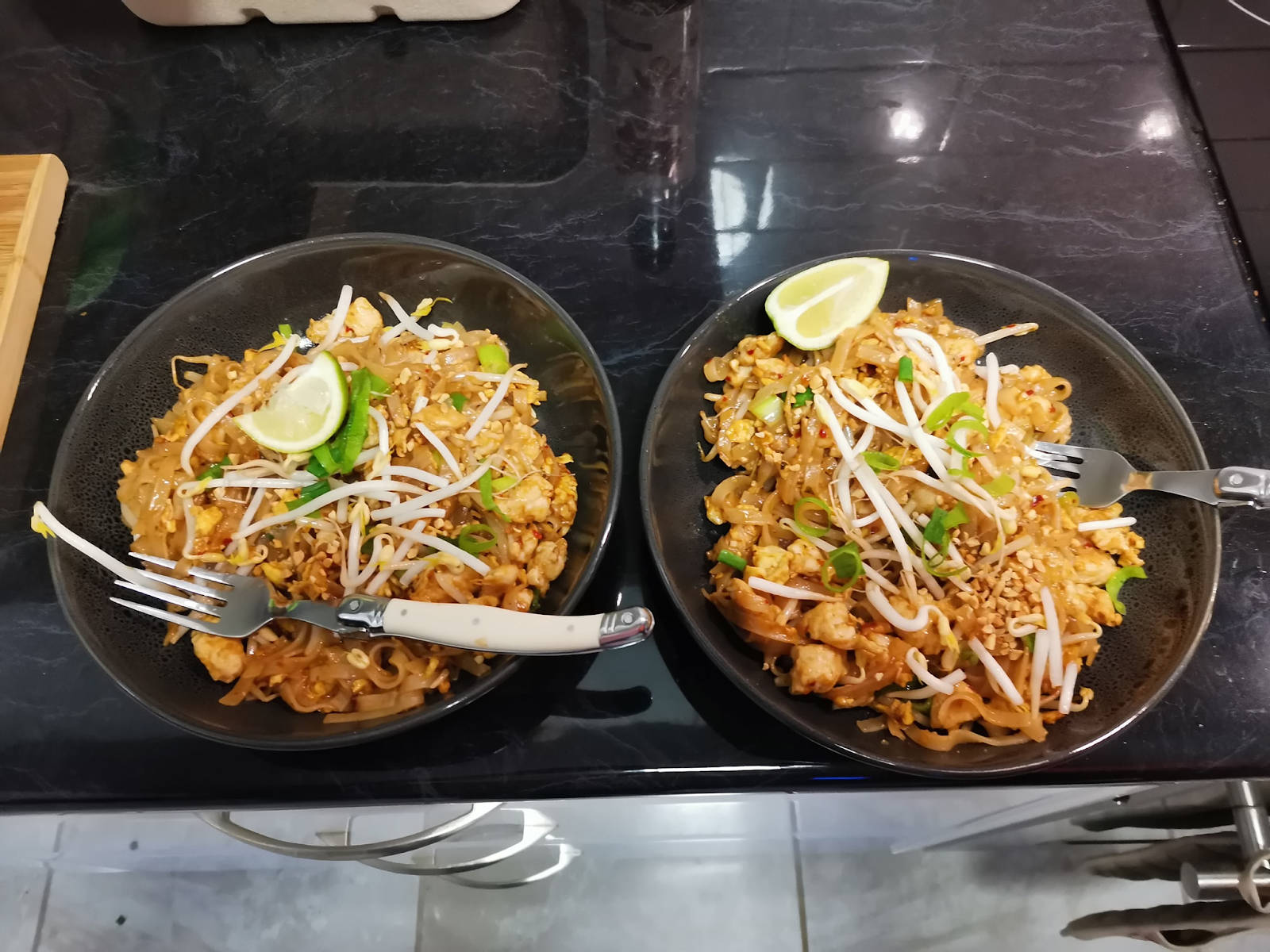 Delicious Pad Thai Noodles In Black Bowls Background